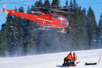 Helicopter arriving after ski accident - covered or not covered?